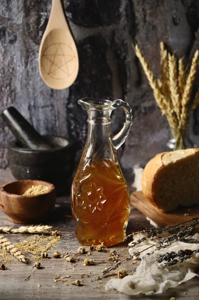 A chamomile simple syrup ina decorative pouring bottle