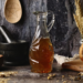 A chamomile simple syrup ina decorative pouring bottle
