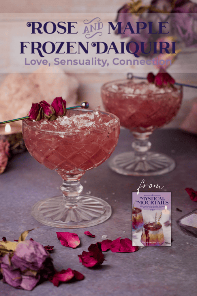 A frozen nonalcoholic magenta-colored rose tea daiquiri with rose bud garnish.