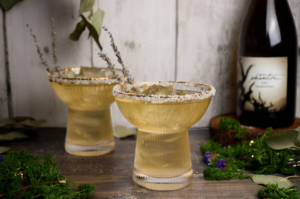 White wine margaritas with sea salt rim and lavender garnish.