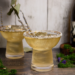 White wine margaritas with sea salt rim and lavender garnish.