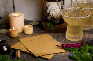 Aged paper on wooden desk with stylus and candles