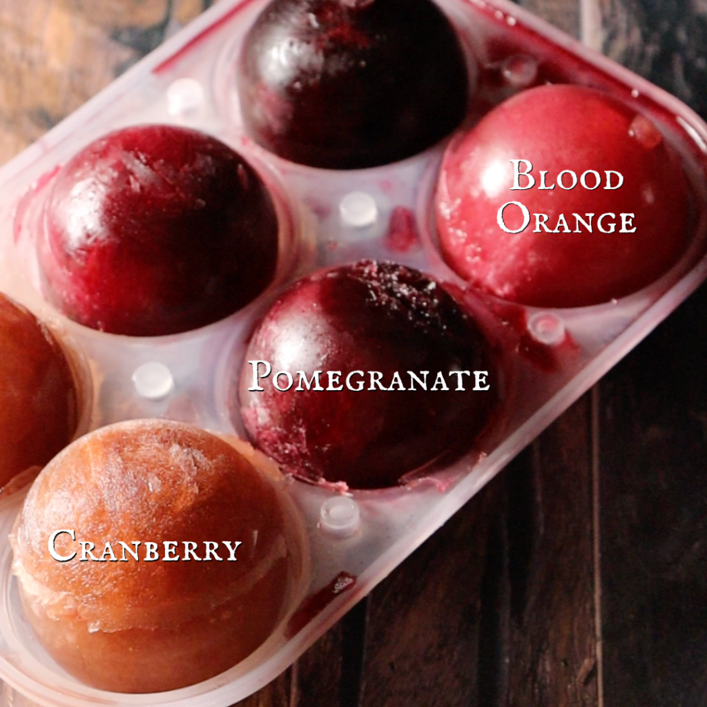 Red Ice Cube Spheres in varying shades of red made from different fruit juices like cranberry, pomegranate, and blood orange